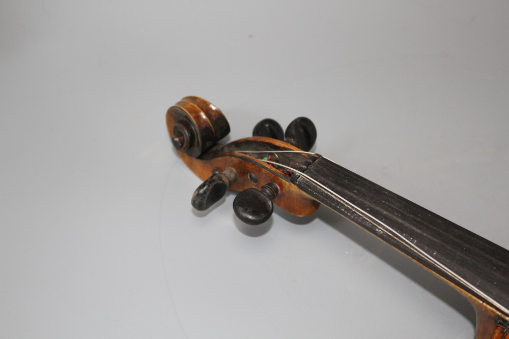 A violin with two piece back and bow, and a childs violin with bow, both with cases